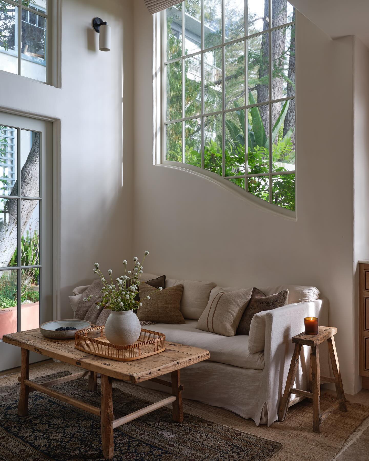 a small french country living room with natural beauty