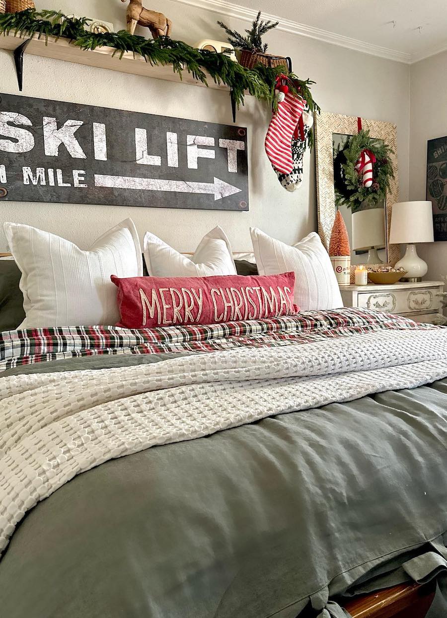 a bedroom with green, red, and white christmas decor
