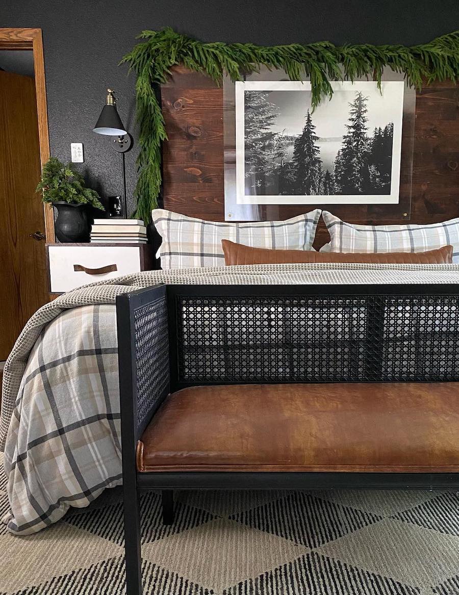 a rustic bedroom with pine accents and plaid bedding