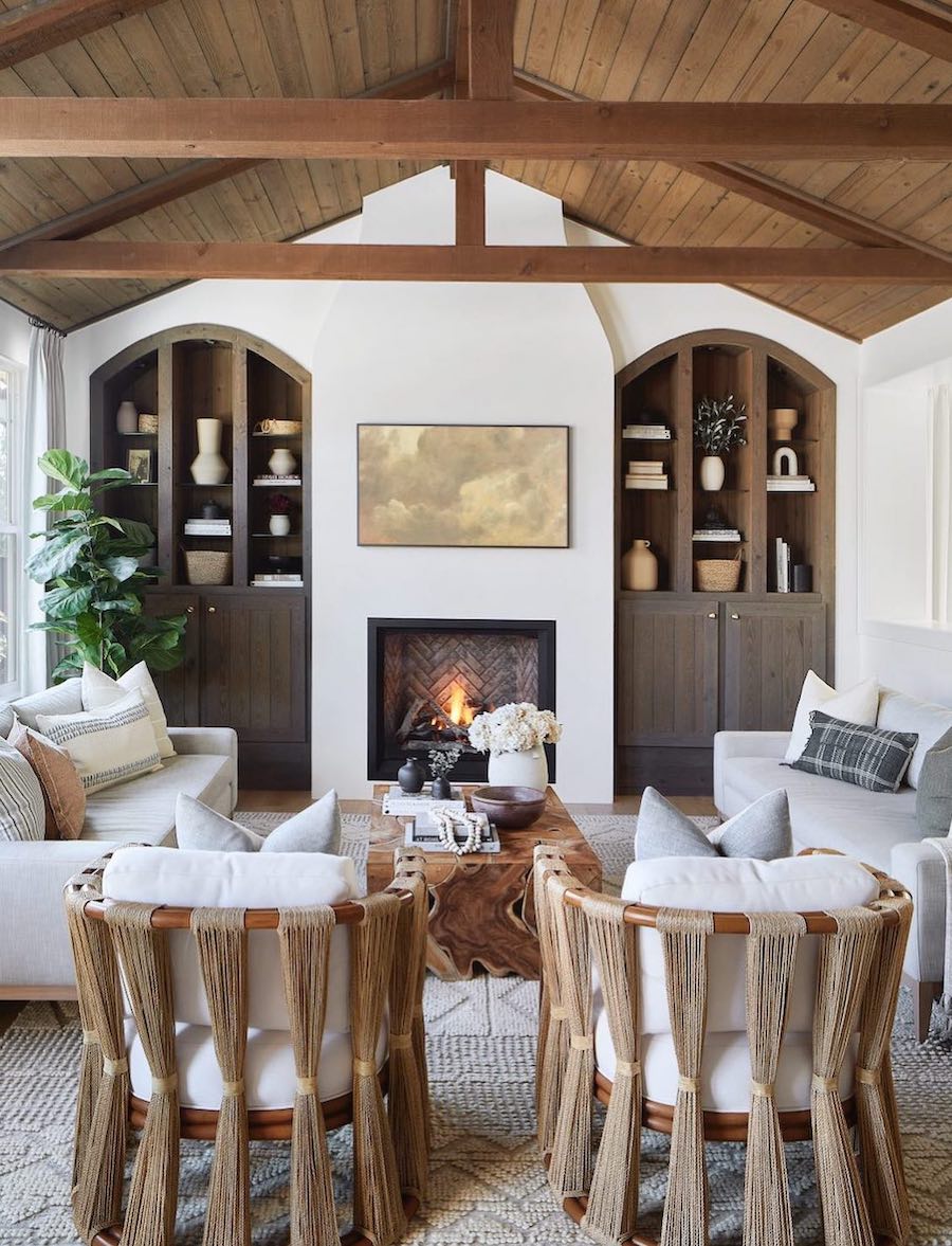 a coastal living room with wood accents and ivory furnishings