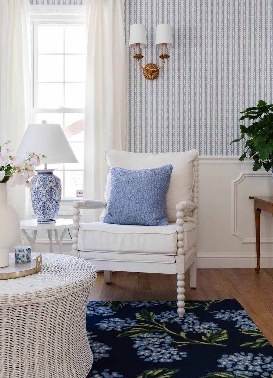 a coastal-inspired living room with soft blue tones and elegant decor