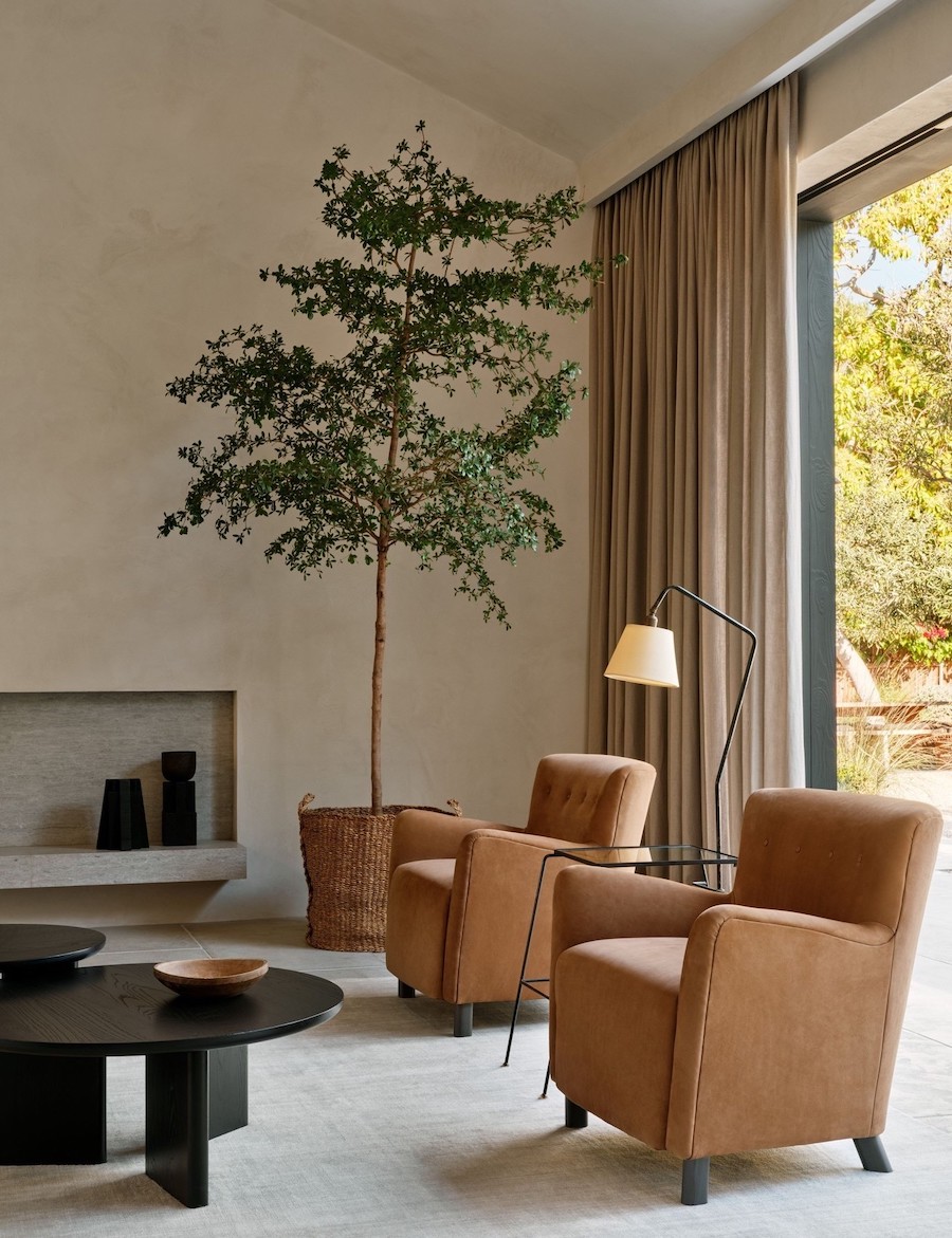 an earthy living room featuring brown and beige tones and natural materials and decor