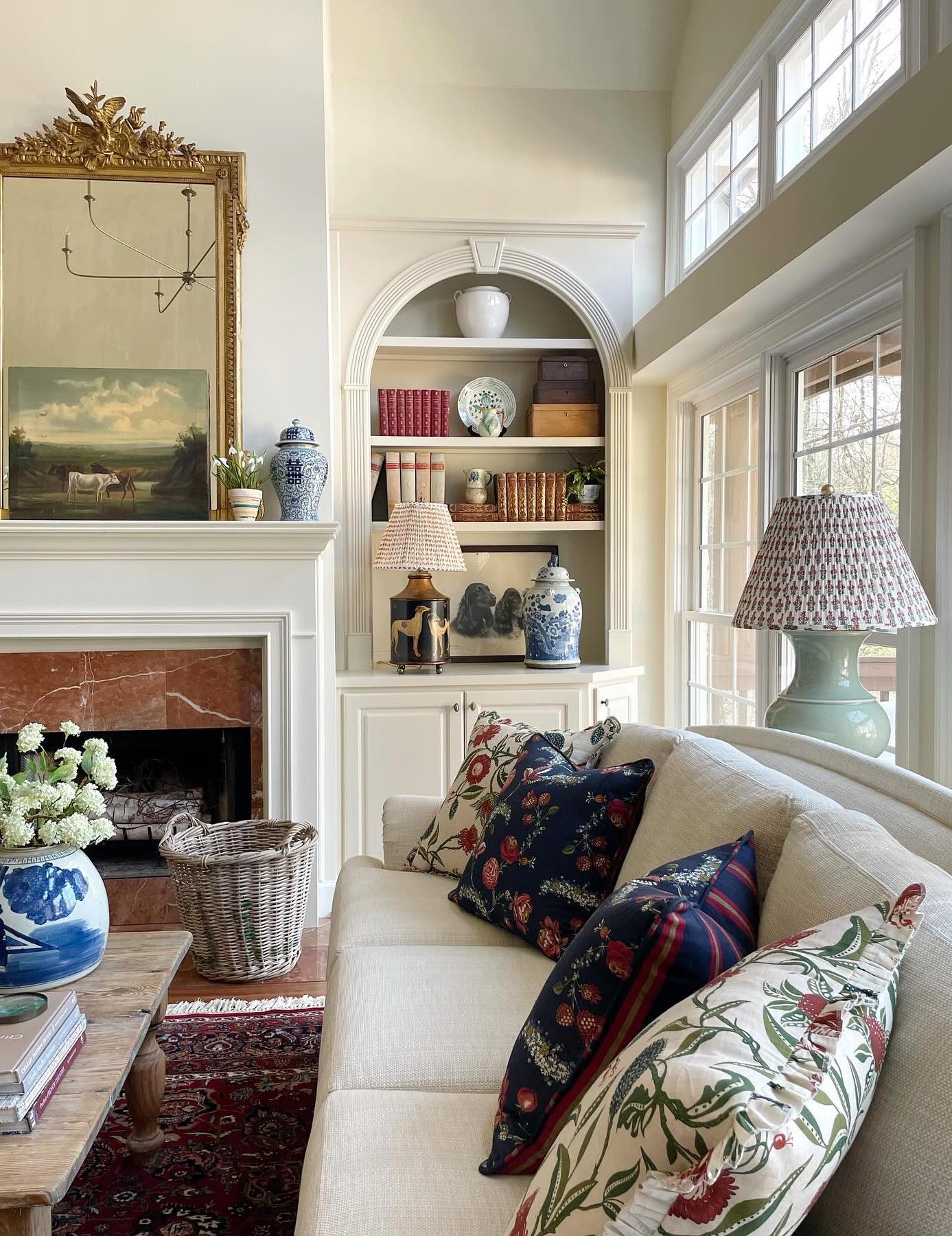 a french country living room with antique pieces and bright colors