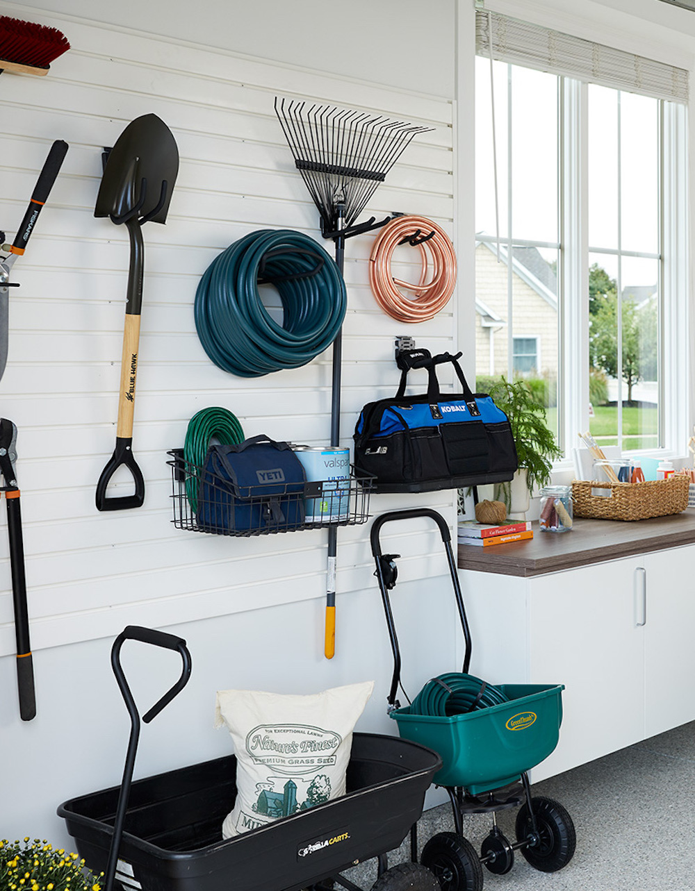 an organized garage featuring garden organization