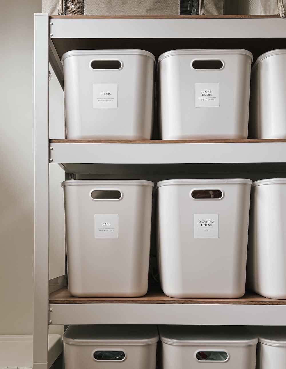 an organized garage featuring labeled bins