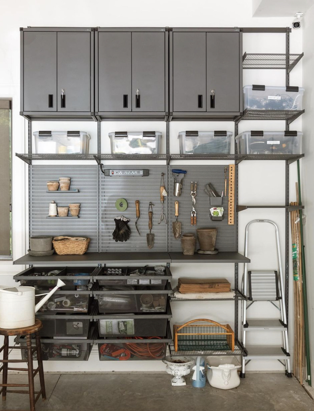 an organized garage featuring customized tool storage