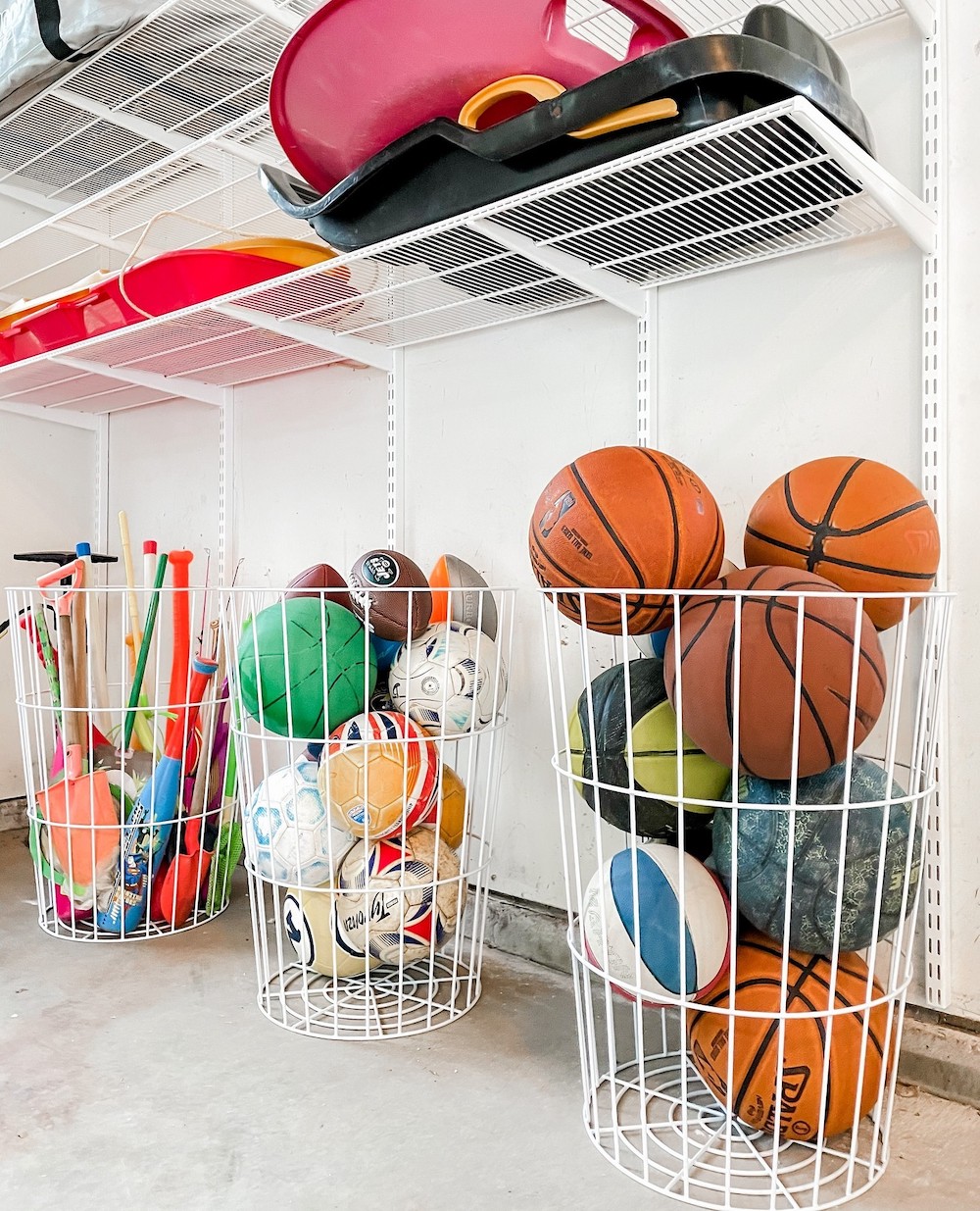 an organized garage featuring sports and outdoor toy organization