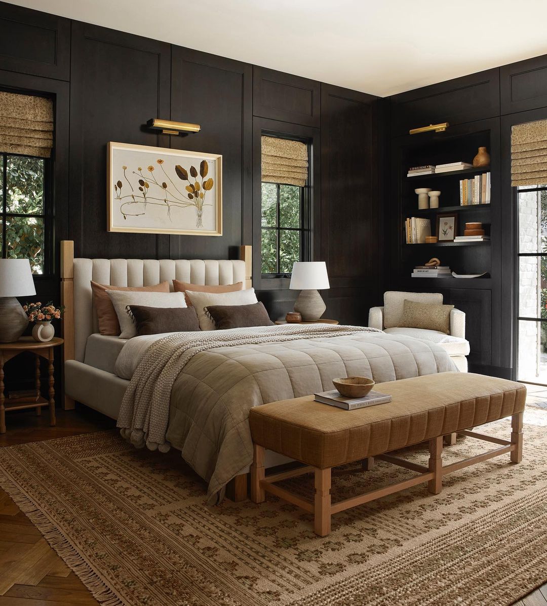 a moody bedroom featuring neutral tones