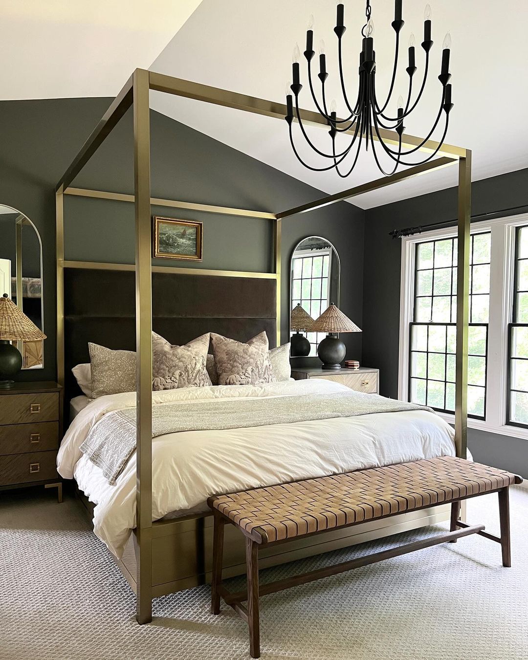 a moody bedroom featuring traditional furnishings and dark tones