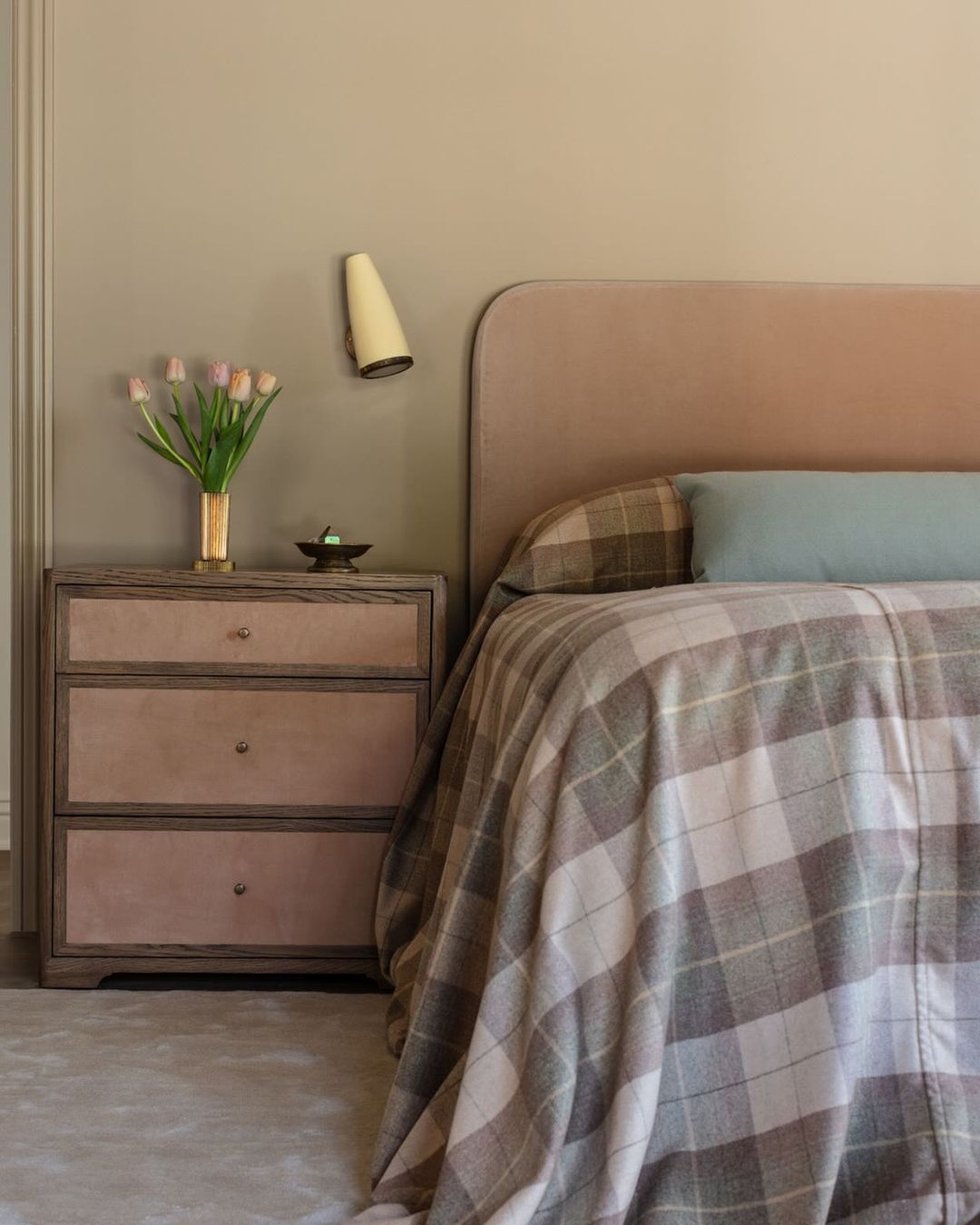 a moody bedroom featuring vintage details