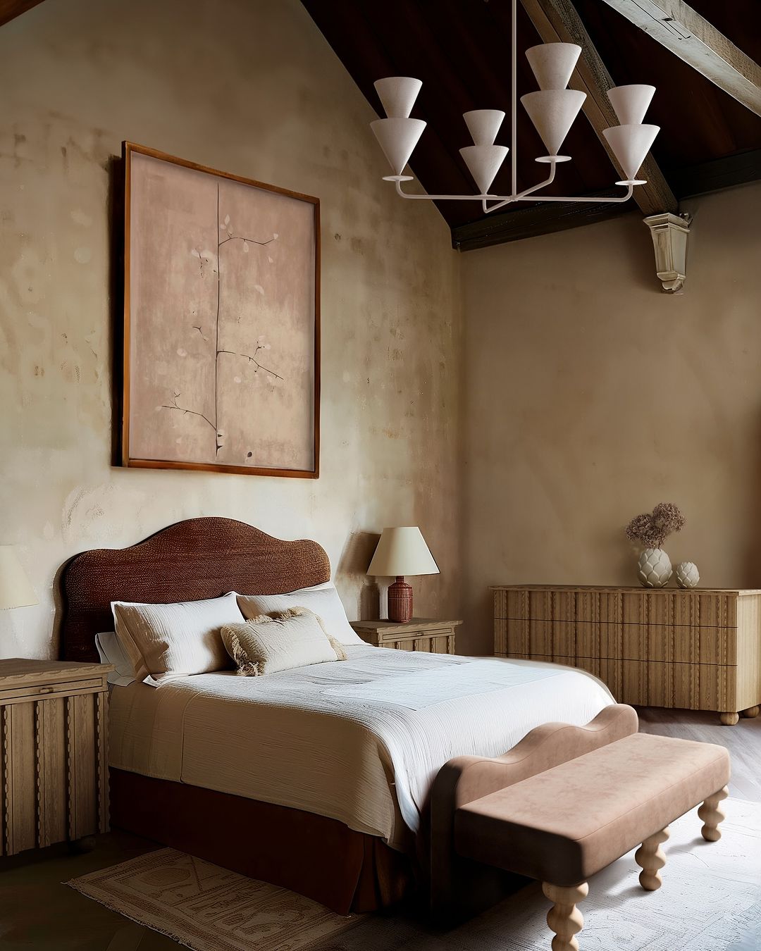 a moody bedroom featuring limewashed walls and dramatic decor