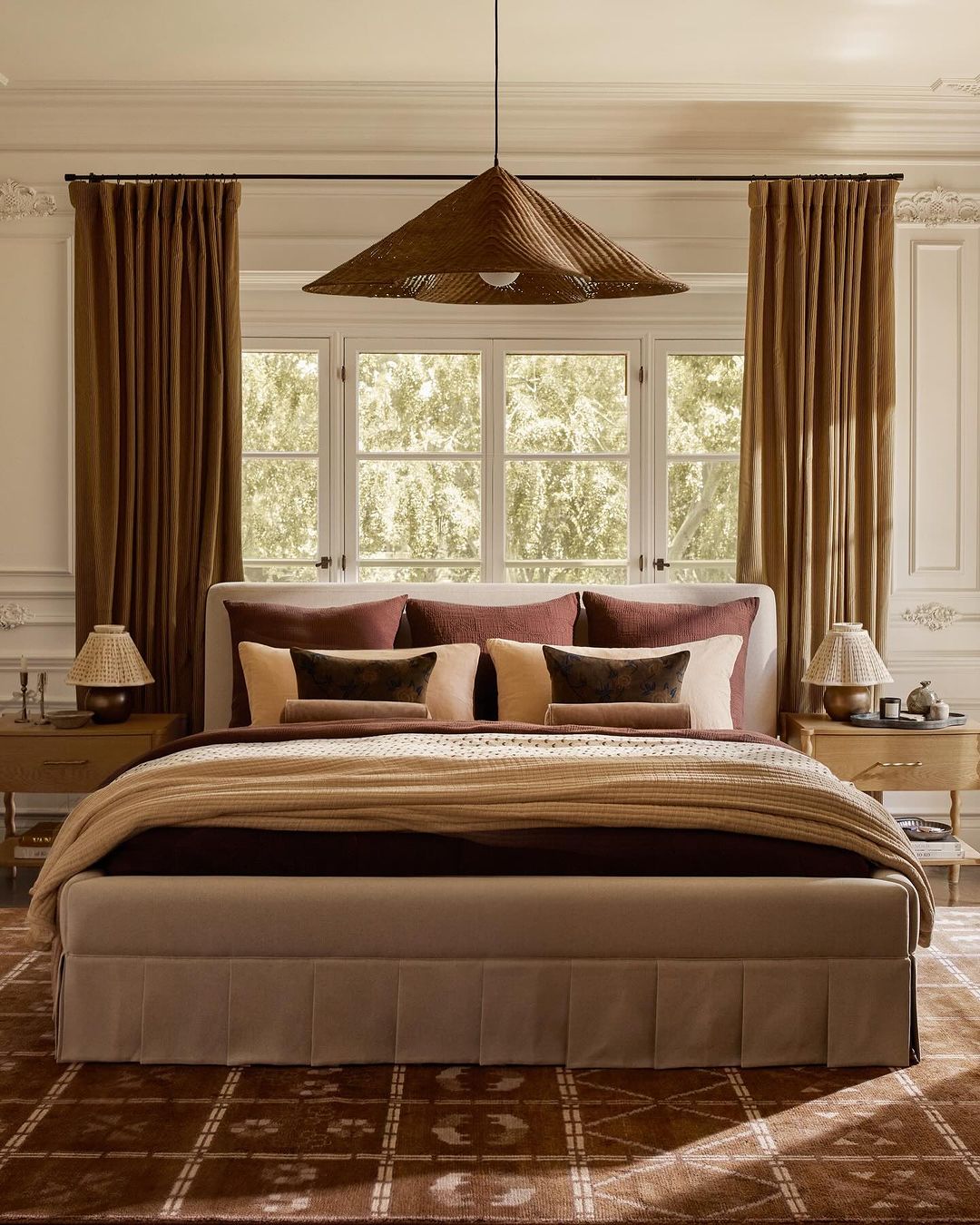 a moody bedroom featuring warm autumn tones