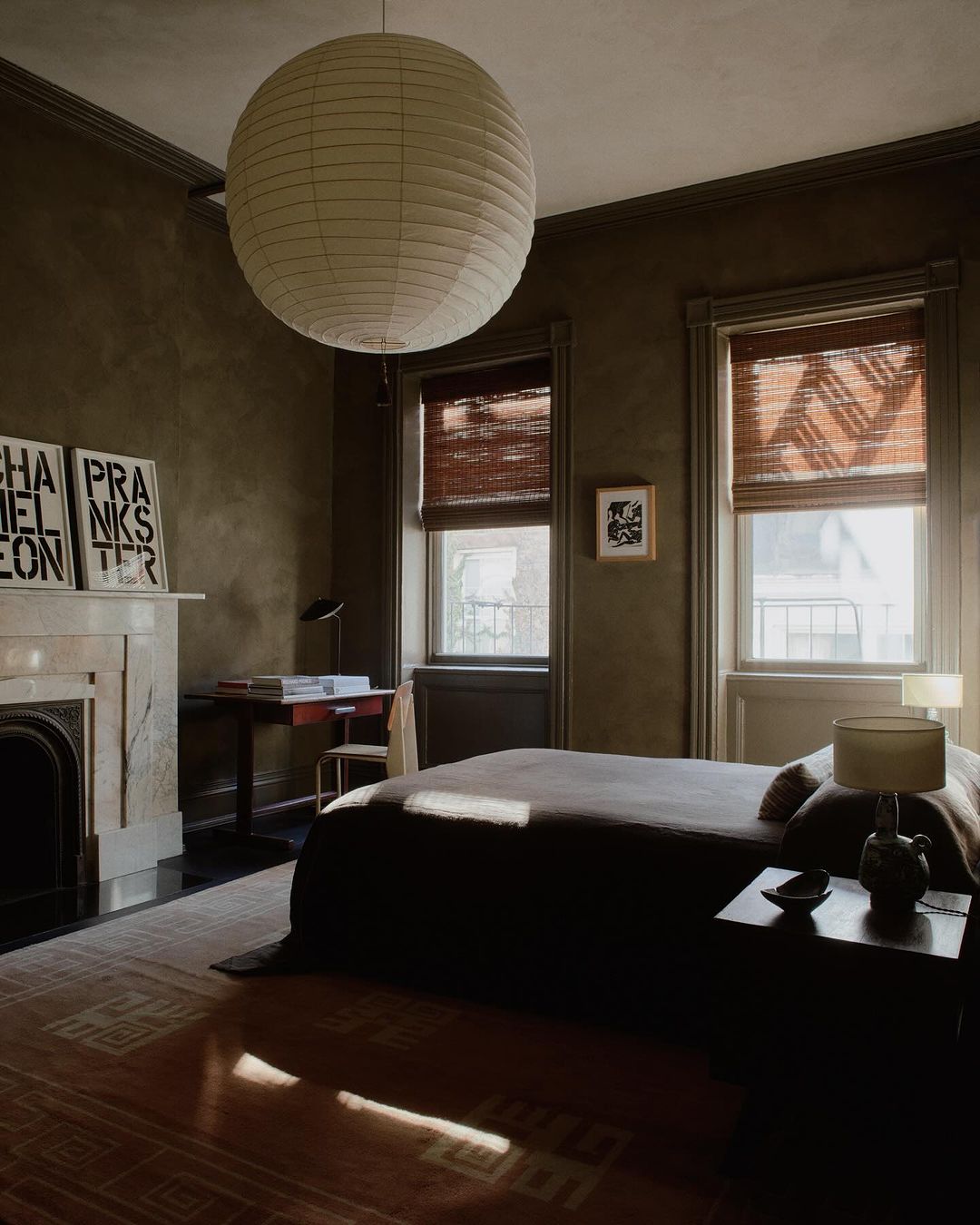 a moody bedroom featuring statement pieces