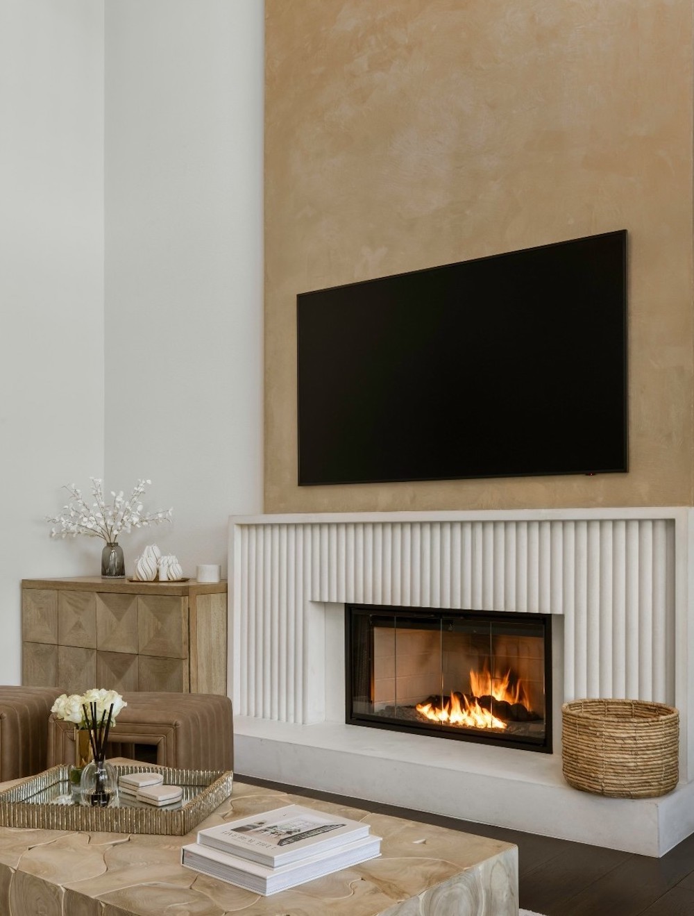 a plaster fireplace in neutral tones