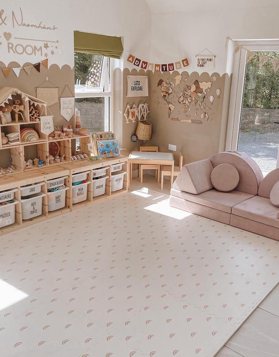 a playroom featuring low shelves and nugget couches