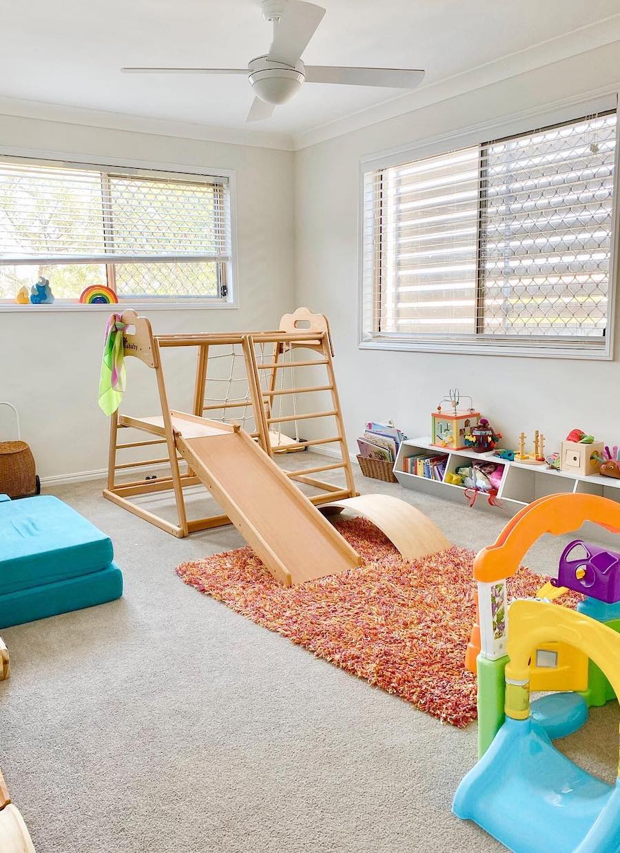 a playroom featuring indoor play equipment