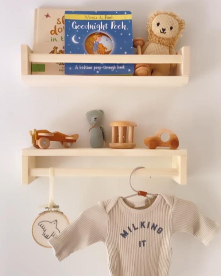 Natural birch Bekvam shelves from @littlebluenestbaby displaying books, wooden toys, and hanging baby clothing.