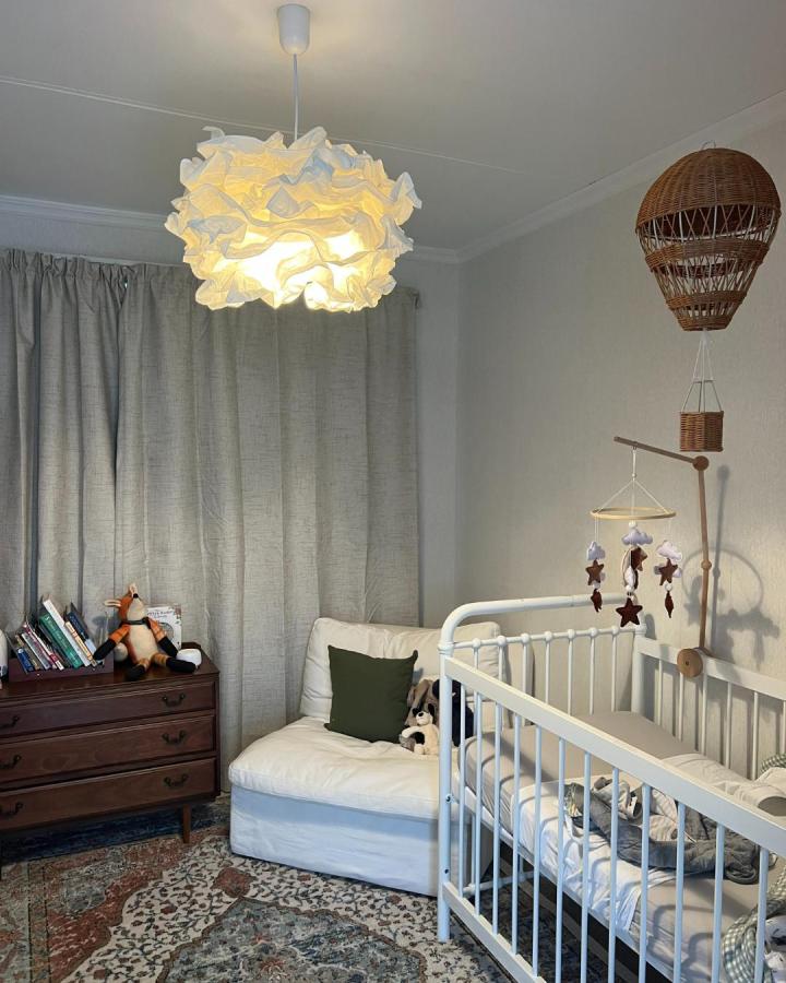 White ruffled Krusning pendant light in nursery from @urbansales_nz showing ikea baby room hacks & ideas with soft glow.